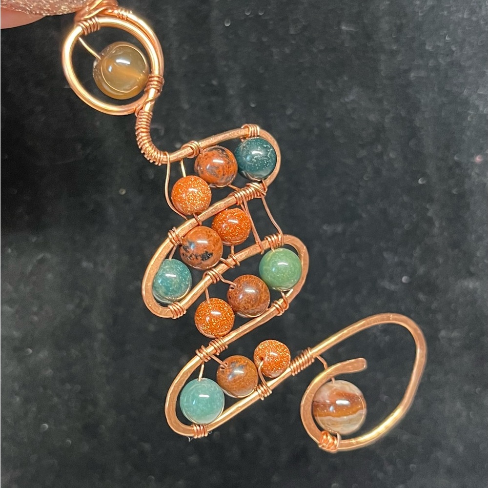 Unique abstract hammered copper pendant